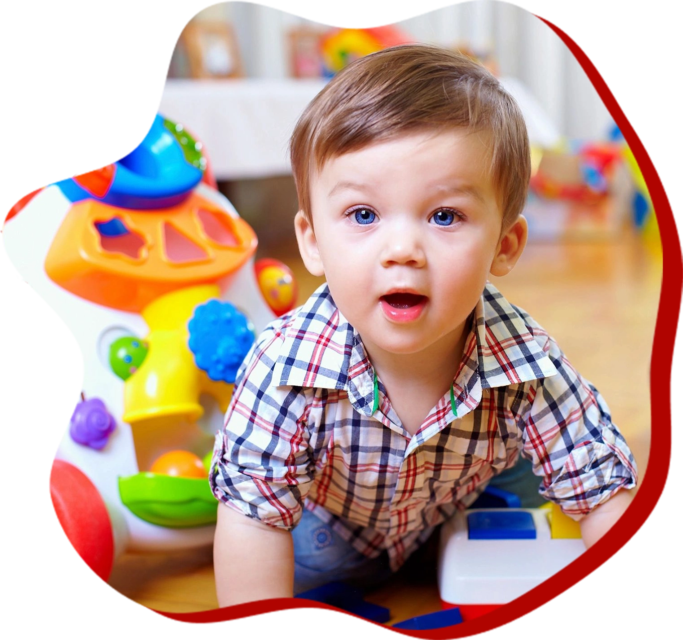 a baby looking at the camera in a classroom